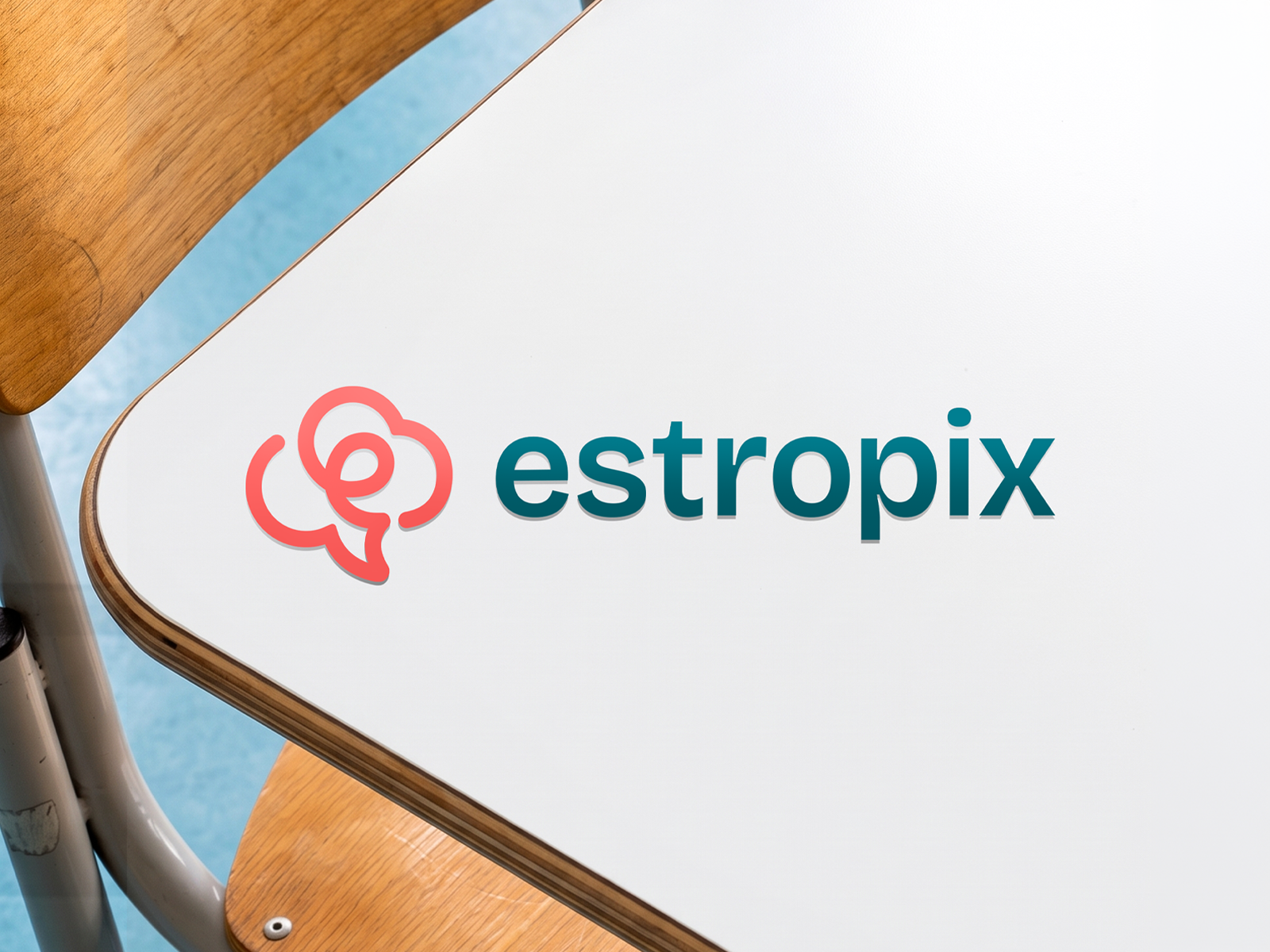 Estropix logo applied on a school desk mockup