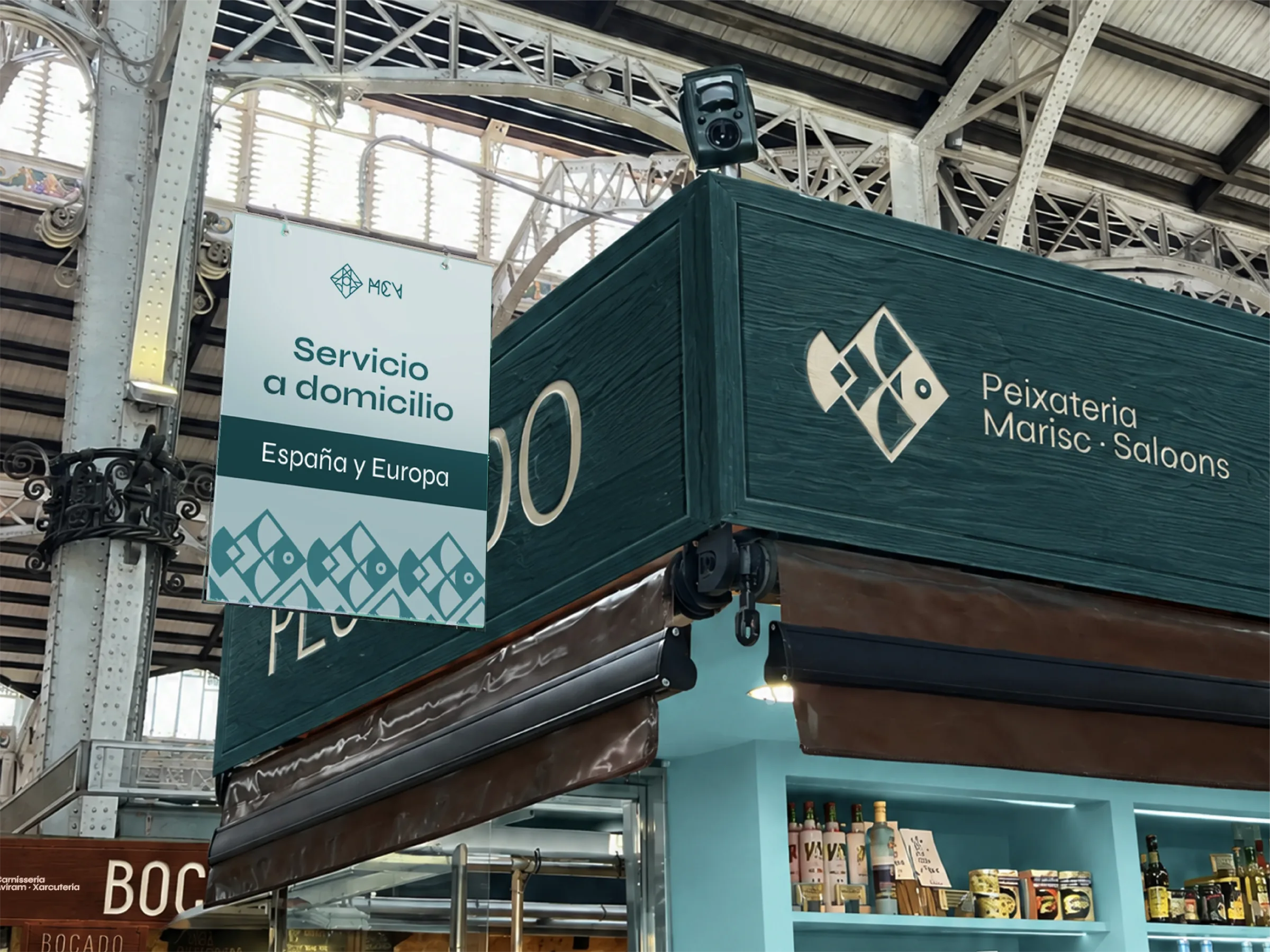 Peixateria stall sign in the Mercat Central colours, with a home-delivery hanging banner